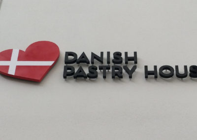 Danish Pastry House Store front pin mount with quarter inch stand off